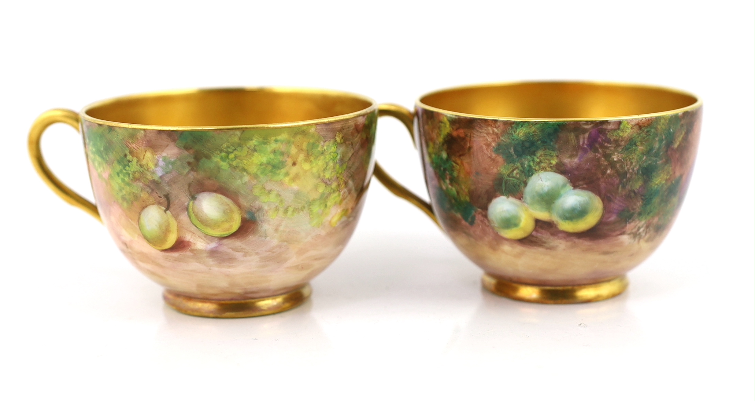 A pair of Royal Worcester fruit painted tea cups and saucers, 1960s
